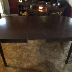 Beautiful Vintage/Antique Dark walnut stained table with 6 chairs $125.00. Or will sell separately