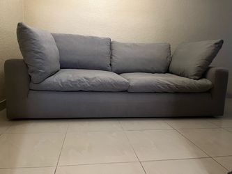 2 Couches with feather pillows