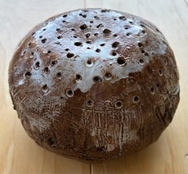 Handmade clay ball shape incense holder. 5” diameterX2 3/4” tall.
