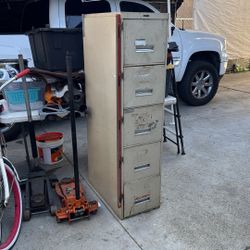 is A Five Drawer Cabinet With Bar Lock