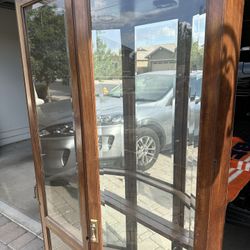 Glass display case with shelves