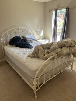 White bed with mattresses