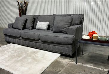 Ashley Furniture Signature By Design Sofa With Accent Nailhead Trim Including Delivery and Matching Pillows