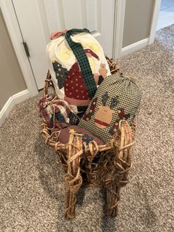 Rattan Sleigh With Stuffed Gift Bags