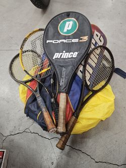 This is a vintage Prince dual-pocket nylon tennis racket bag w/vintage rackets and balls