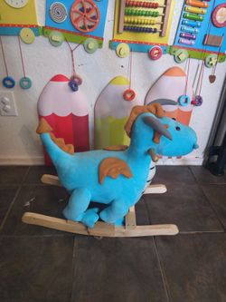Stuffed dragon wooden rocker