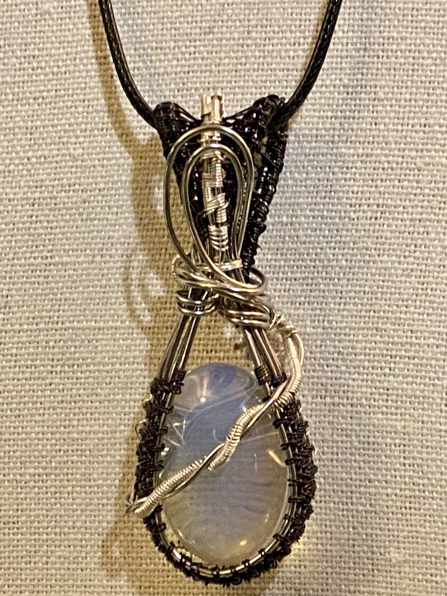 (24) Hand-Crafted Wire-Wrapped Pendant. Silver And Black Wire With Glass Cabochon.