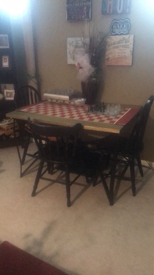 Table and 4 black wooden chairs