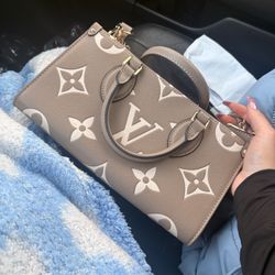 Authentic Louis Vuitton OnTheGo East West handbag