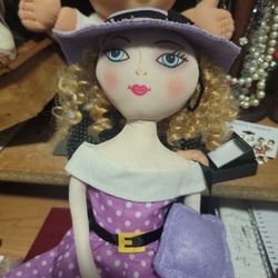 Sitter Dolls With Hat And Purple Dress