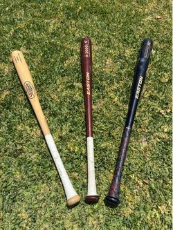 Three wooden bats