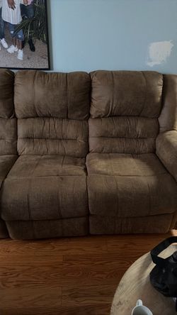 Living room set couches stool chairs and a fireplace
