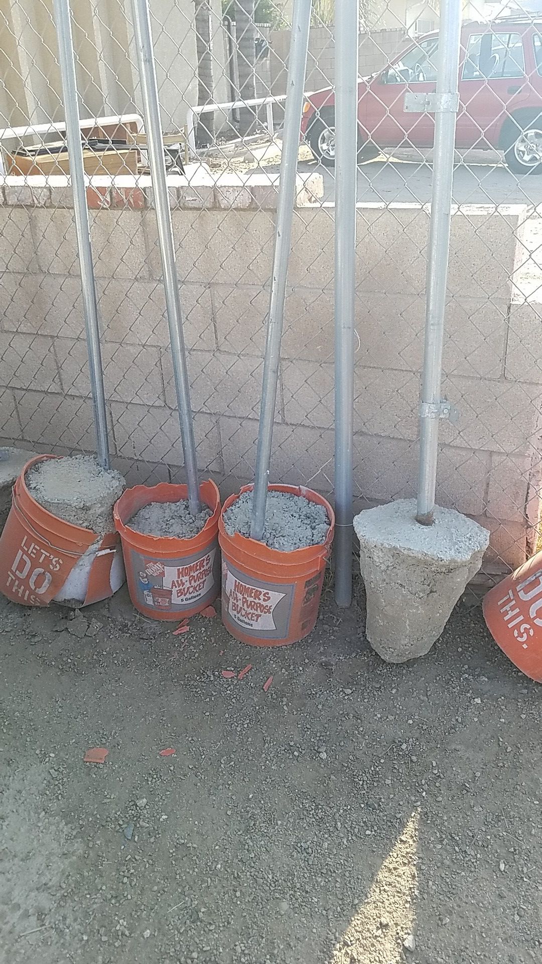 Fence post in buckets with concrete
