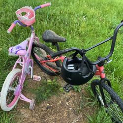 A Black Bicycle With A Black Helmet  $20 And A Pink Tricycle  $10