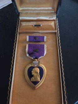 Wartime era purple heart and bronze star medals....NO NAMES AND NO NUMBERS