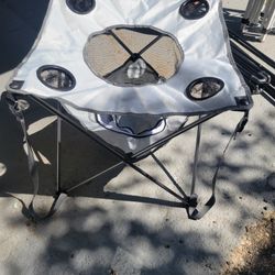 NEW. OUTTERBANKS. CAMPING TABLE WITH COOLER AND SNACKHOLDER. WITH CARRYING BAG
2  COLORS.  GREY. GREEN. 
 11525 S HALSTED.  Dunkin Donuts/
7111.S WEST