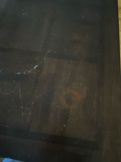 Dark wood table and 4 upholstered chairs.