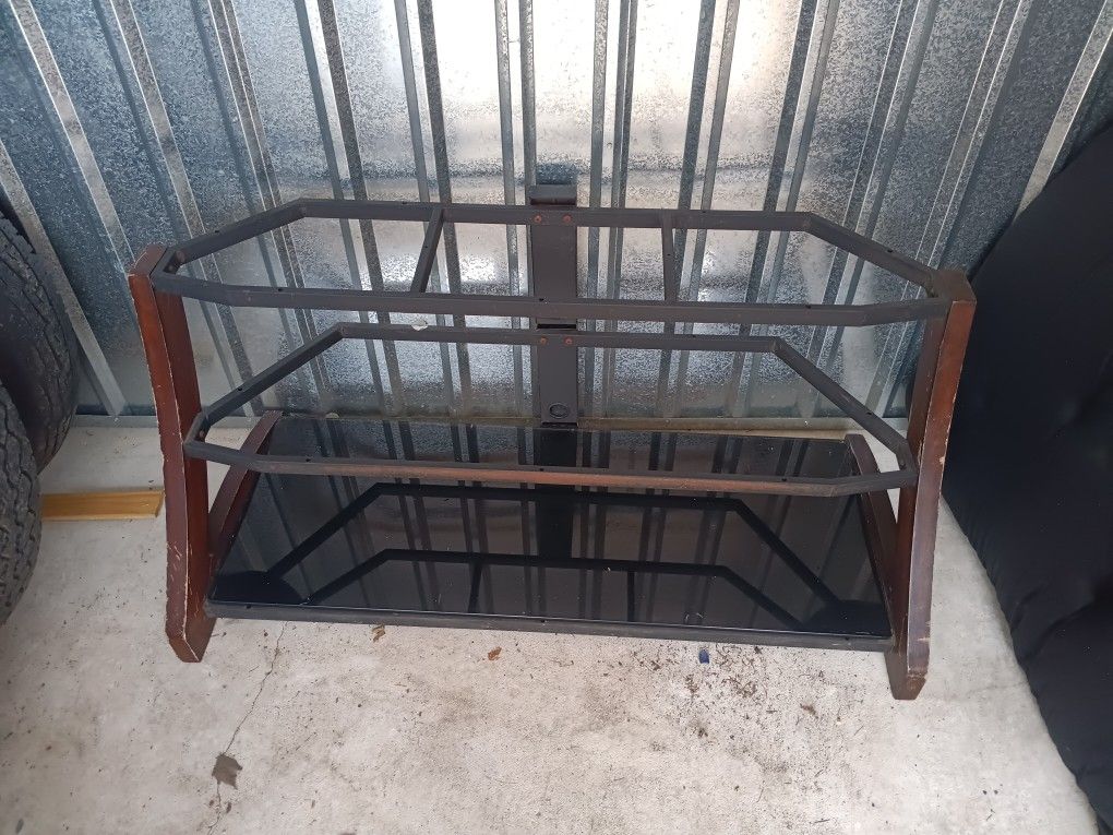 This Wood, Metal & Glass Entertainment Center/TV Stand