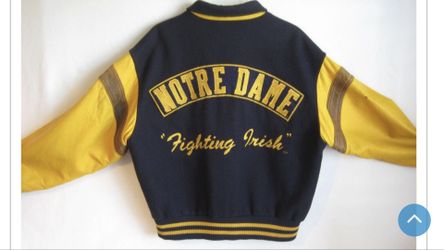 Jacket. Notre Dame Fighting Irish vintage fans jacket size (M) fits like a large leather sleeves wool body