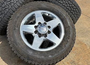 20” OEM 2018 GMC SIERRA 2500HD WHEELS POLISHED GOODYEAR AT LT275/65R20 90% LOAD E 8x180