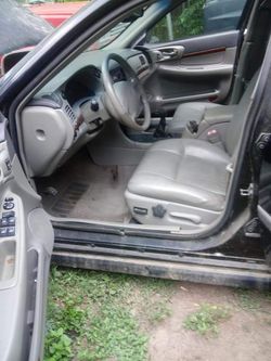 2001 Impala black color it's in good condition I want a $1000 for it .