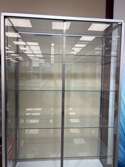 2 tall clear shelved cases