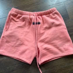 fear of god essential shorts color is coral and it is a size large