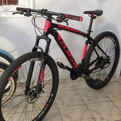 GW Gusan 29" hardtail MTB with front suspension, disc brakes, and an aluminum frame.