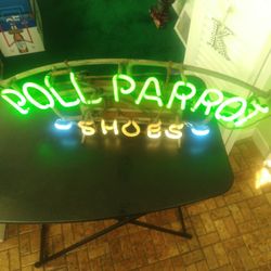 vintage neon shoe sign
