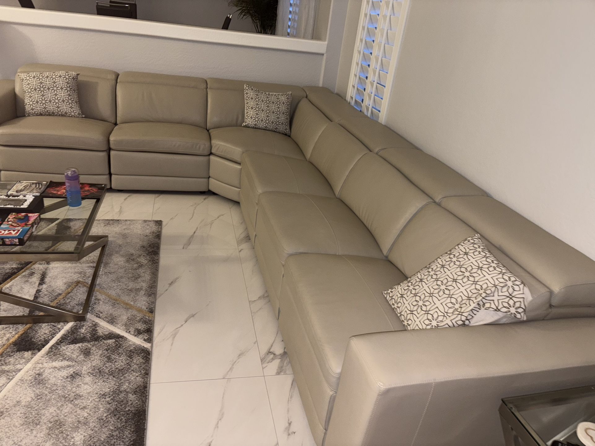 Beige leather sectional and armchair set