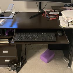Black wood desk with keyboard tray