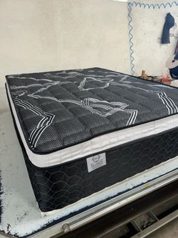 Queen size mattress pillow top 12”.     New mattress in a plastic sealed