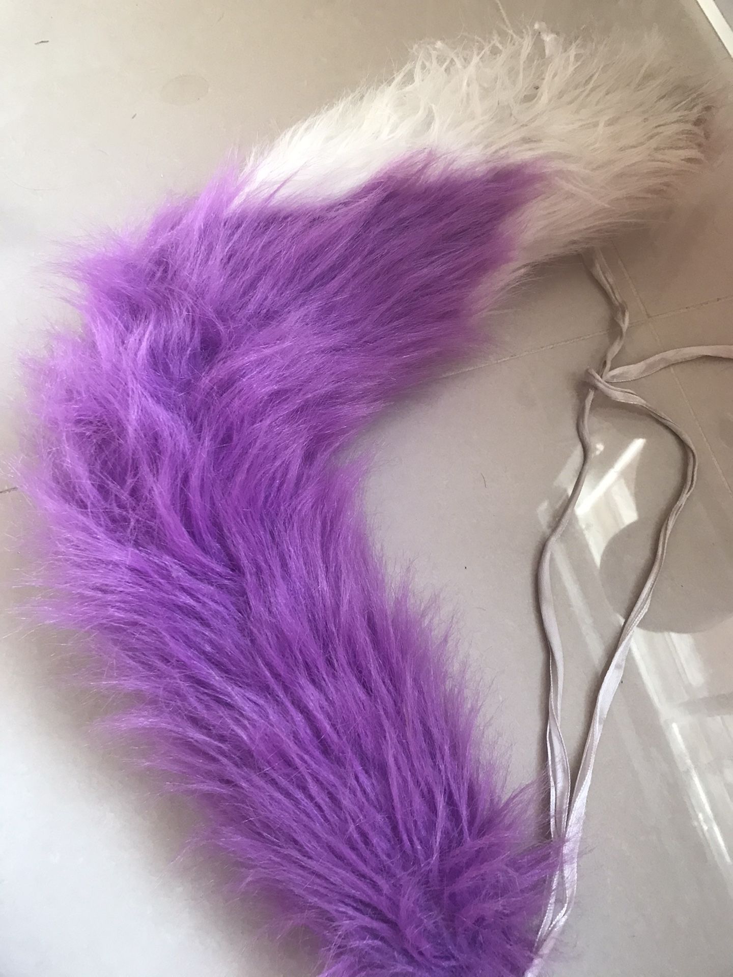 Purple furry tail strap