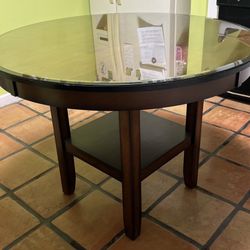 Table 42”. Diameter.  Glass Top  4 Chairs 
