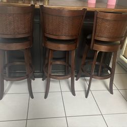 Three Black and Tan Wooden  Swivel Barstools 