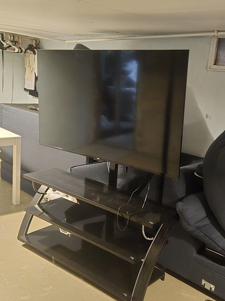 Roku 65in TV With TV Stand