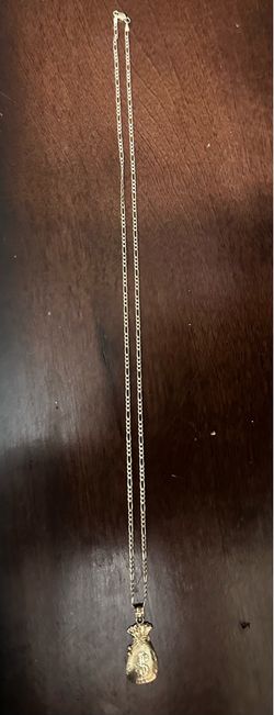 14k figaro chain with small moneybag pendant