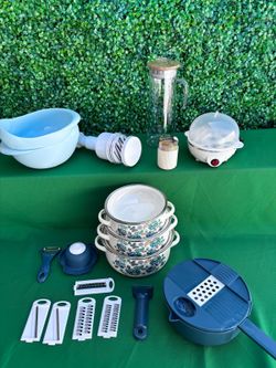 Kitchen and Cookware Set.   One pot set with three pots One egg steamer.  One multi use veggie cutter with  different blades and veggie peeler.  One v