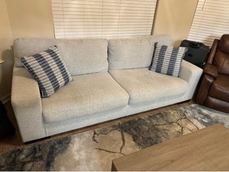 Ashley Couches with a recliner chair and a table