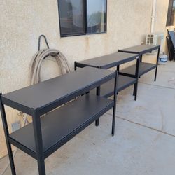 3 metal shelfs, csn be used as work tables with storage space on the bottom.  Can be used in a garage or sheds to organize tools or home decor. $20.00