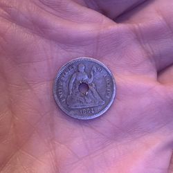 1864 Silver Seated Liberty half dime coin (holed)