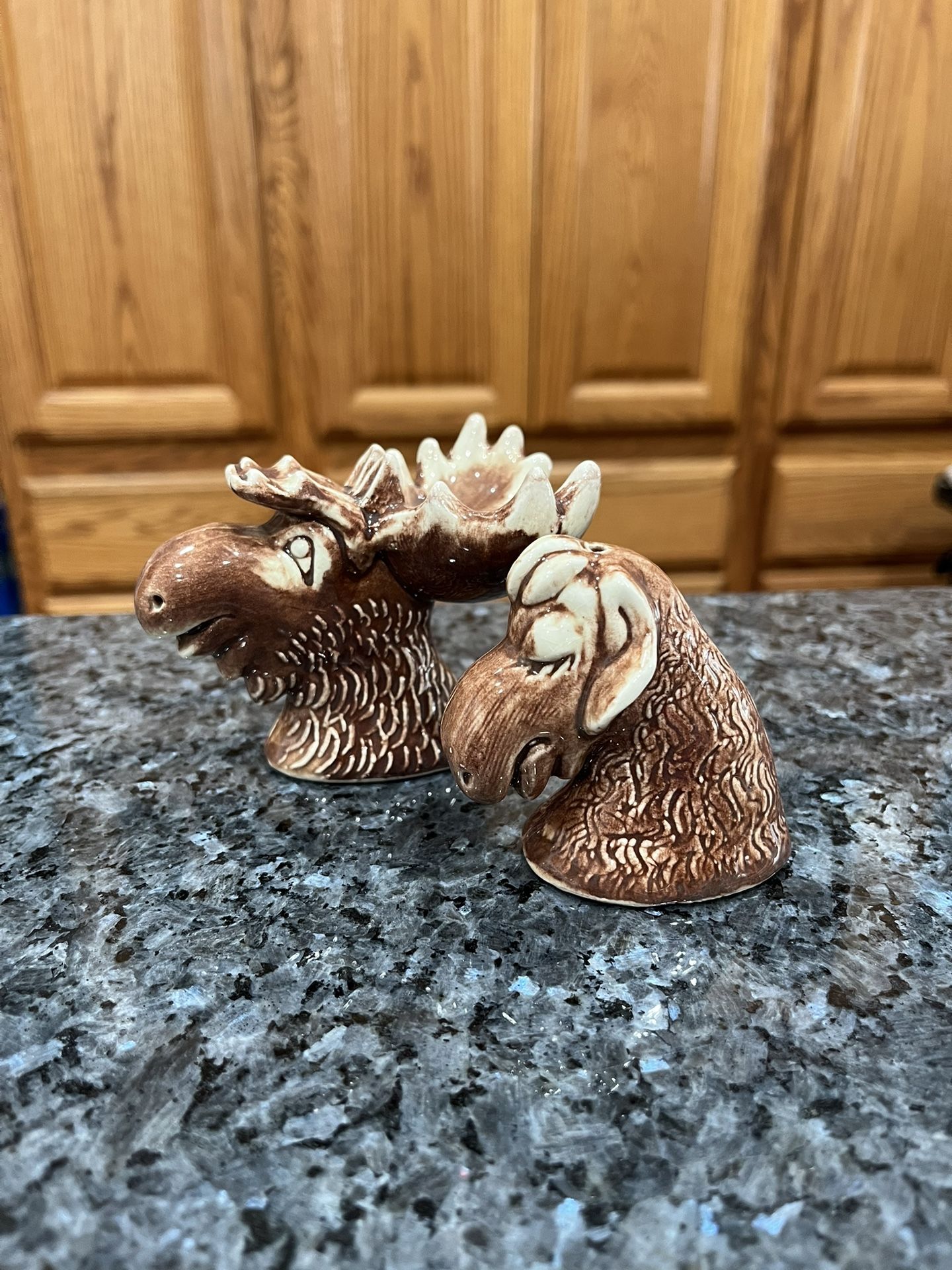 Ceramic Vintage Moose and Cow Pair of Salt and Pepper shakers. Size approximately Moose 3 inches tall. Preowned no stoppers.