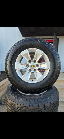 17" CHEVY OEM rims w/ Brand new tires. $850