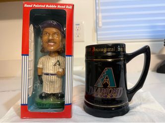 Diamondbacks Corbin Carroll and Randy Johnson bobbleheads and inaugural stein