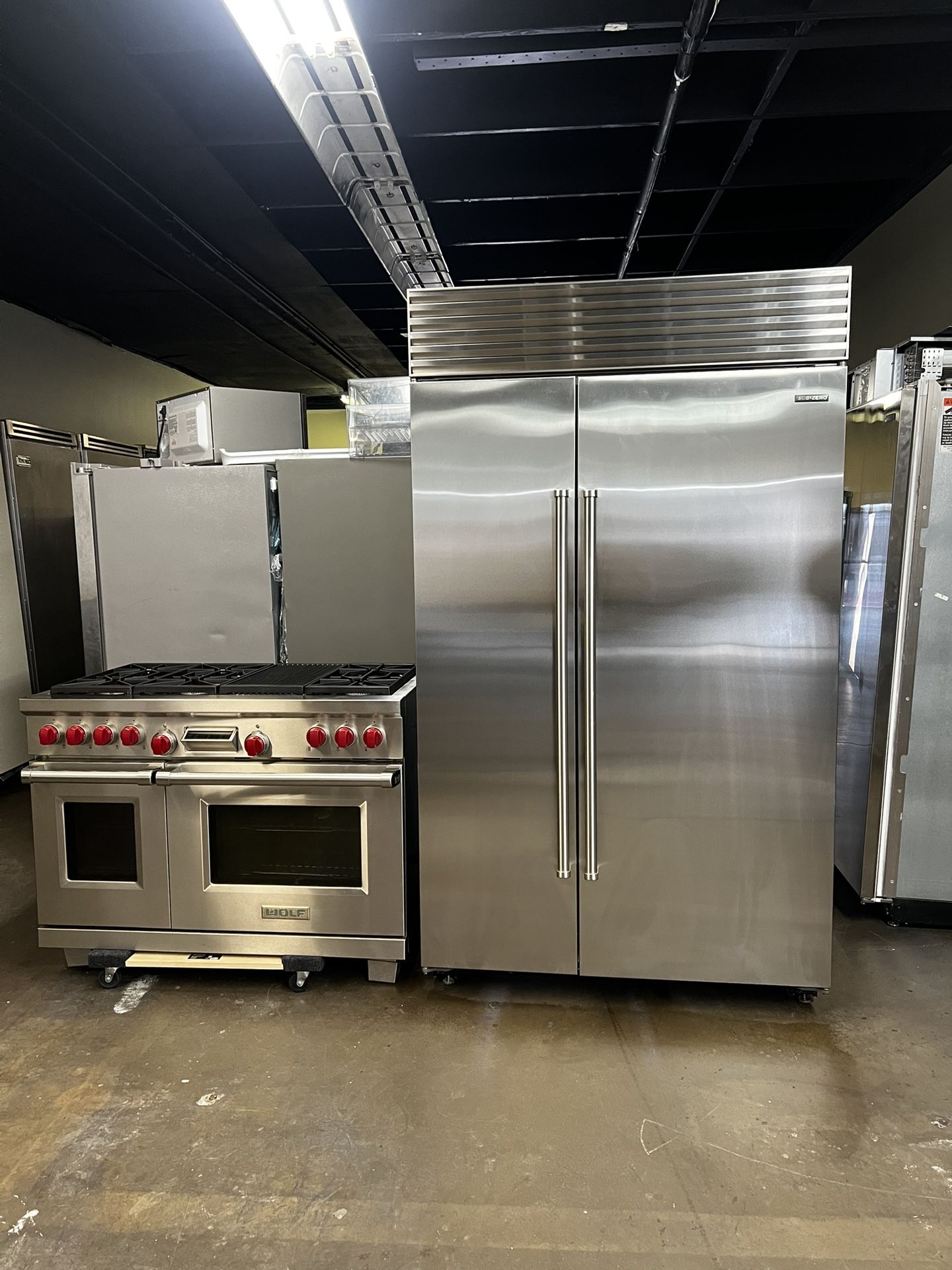 Wolf 48”Wide Dual Fuel Range Stove And Sub Zero 48”Wide Built In Side By Side Refrigerator