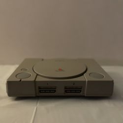 PLAYSTATION 1 WITH TWO CONTROLLERS AND 3 MEMORY STICKS NO CORDS