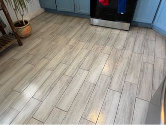 Porcelain tile and large Oakwood table with dining cabinet to match