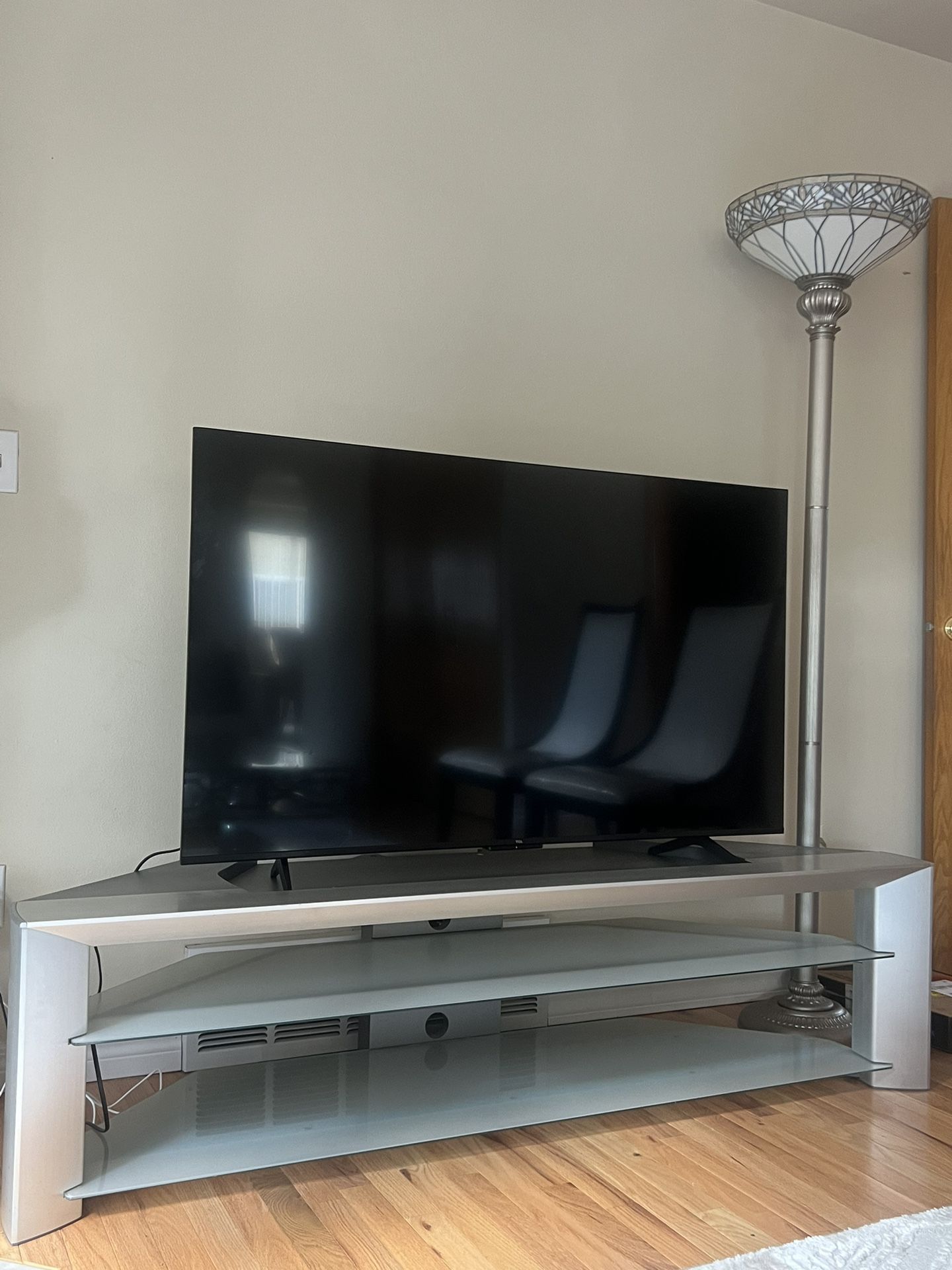 55 Inch TCL tv, Console, and 6ft Lamp