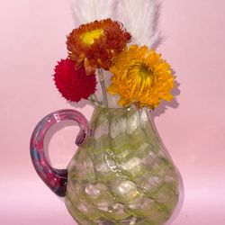 vintage spatter glass pitcher, likely dating back to the late 19th or early 20th century.