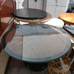 Art Deco-style round pedestal dining table with a Macassar ebony sunburst veneer top and glass cover $1350 OBO